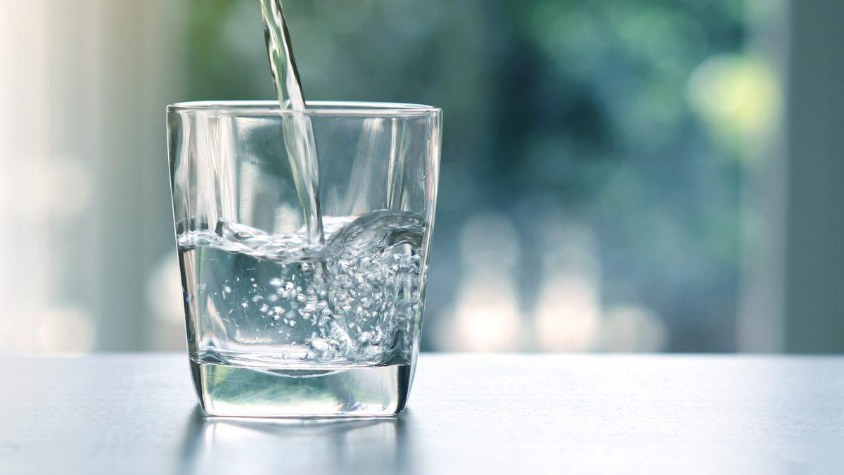 Water being poured into a glass.